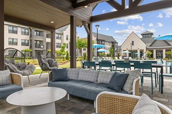 Summerhouse with grills, picnic tables, and tv